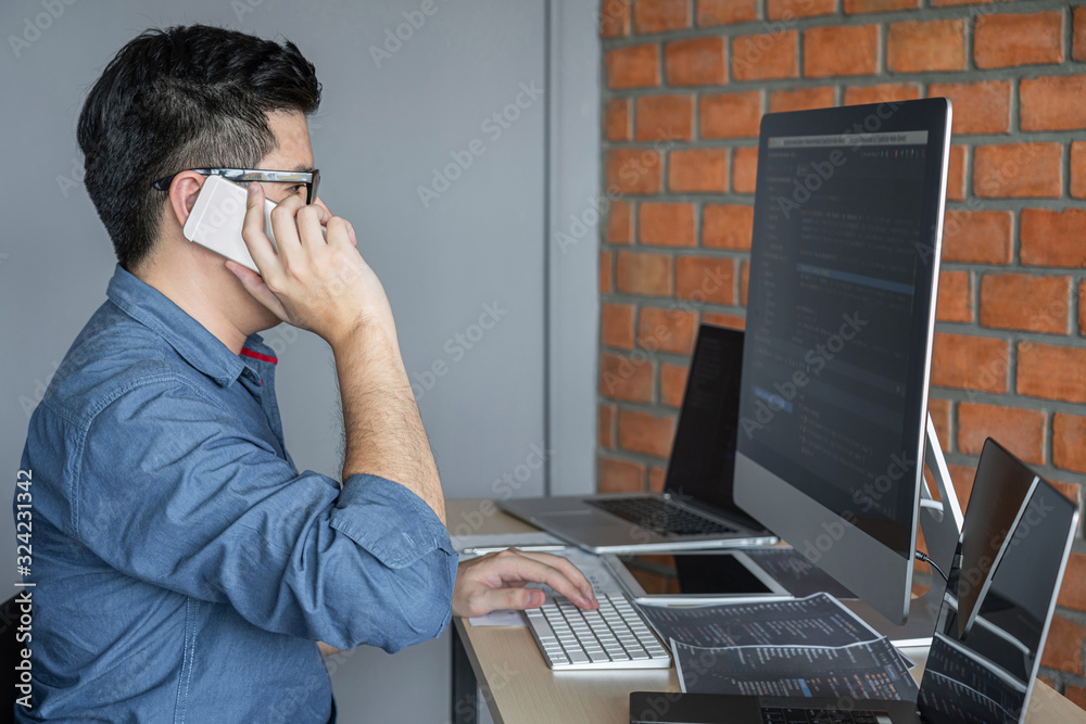 Aufkleber Young Professional programmer working at developing programming and website working in a software develop company office, writing codes and typing data code, Programming with HTML, PHP and javascript