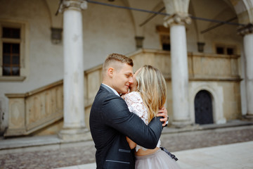 Two lovers walk along Krakow