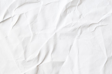 Creative background with scattered overlay of crumpled papers.