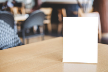 Mock up acrylic frame posters pattern template forms background, blank menu frame on table in coffee shop stand for your text of display your product