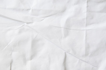 Creative background with scattered overlay of crumpled papers.