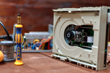 Disassembled cd-rom optical drive for a desktop personal computer. Repair and maintenance of...