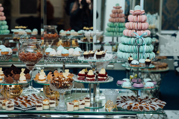 Candy bar with balls, macaroon on candy bar, candy bar on holiday, candy bar at the wedding