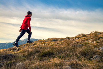 Young man hiking in the national park. Experience freedom in the heart of nature.