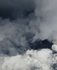 Fototapeta na wymiar Fragment of a stormy sky with white clouds