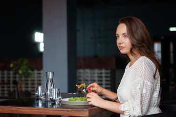 Woman has lunch in cafe