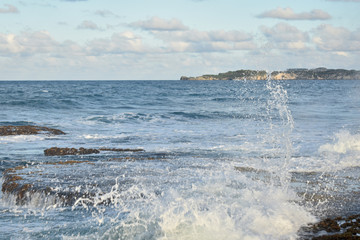 waves breaking on shore of the sea
