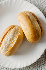 bread in a plate,lying bread in a plate to prepare for fast food,sandwich for butter,fast food butter lies in the kitchen utensil on the table