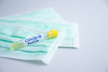 Coronavirus lab tube, covid-19 vaccine, medicine for treatment with n95 mask