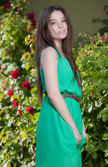 Portrait of beautiful young girl in summer garden.