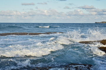 waves breaking on the rocks