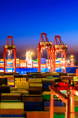 Industrial port container freight terminal at night in Shanghai,China.