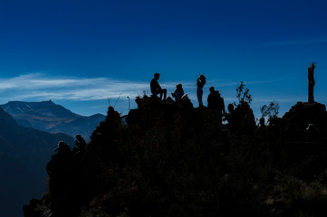 silhouettes in blue sky