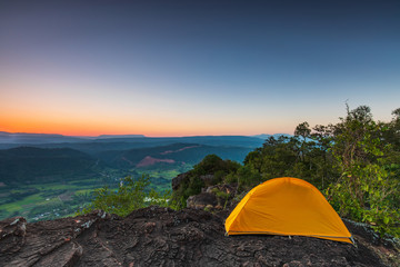 The orange tent's hikers  on the cliff at  Phu-E-Lerd, Loei province, Thailand.