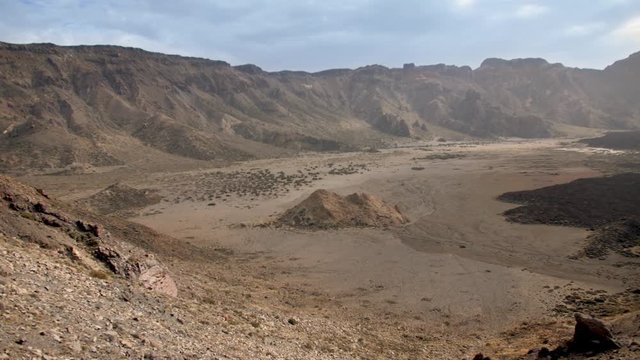 4k panorama of volcanic landscape with high cliffs, mountains and desert on hot sunny day. Valley near volcan Teide, Tenerife, Canary islands