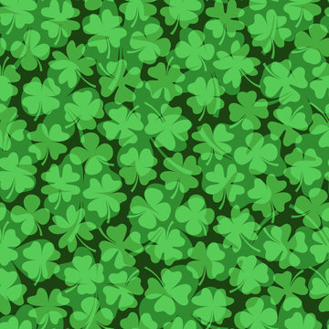 Seamless vector pattern with green four leaf clovers for Saint Patrick's Day backgrounds and graphic design