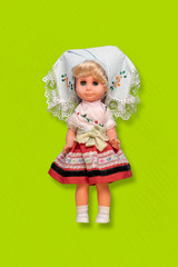 a simple abstract toy doll isolated on the color background with copy space, float in air