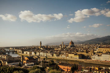 Fototapeta na wymiar Aerial panoramic view of old city of Florence and Cattedrale di Santa Maria del Fiore (Cathedral of Saint Mary of the Flower), Palazzo Vecchio. Panorama of Florence and river Arno in sunny day Tuscany