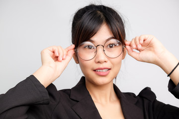 Beautiful attractive business asian women wear eyeglasses smiling on white background