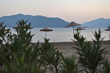 straw umbrellas on the beach. Marmaris. Turkey