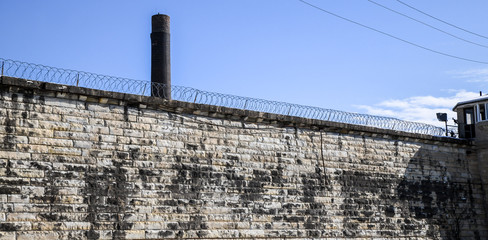 Fototapeta premium Abandoned and historic prison wall