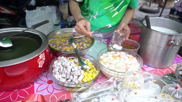Rice balls in sweet coconut milk(Bua Loy), Thai Dessert Recipe cooking and sold in the street food shop thailand