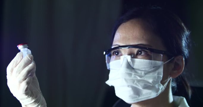 Researcher Working In A Laboratory, Asian Woman, Scientist, Covid-19, Epidemic. Chinese, China