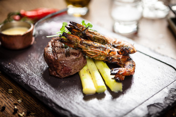 Tasting menu. Beef steak and grilled tiger prawns.
