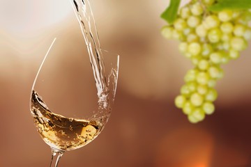 White wine being poured in a wineglass