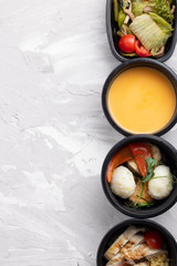 dishes fitness menu in eco-friendly packaging in boxes, vertical