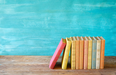 Row of multicolored books, free copy space. Reading, education, literature, learning, book fair...