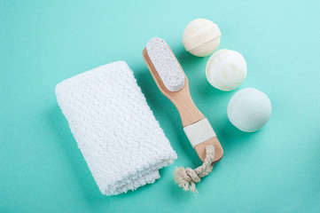 Wooden natural spa objects on mint green background