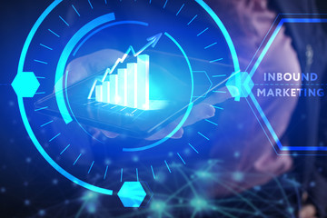 Business, Technology, Internet and network concept. Young businessman working on a virtual screen of the future and sees the inscription: Inbound marketing