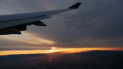 A beautiful sunrise peeks out from the horizon over San Francisco, California.