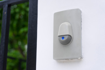 Doorbell or buzzer on mounted on wall detail