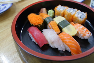 Close up Set of sushi and maki roll on wooden table
