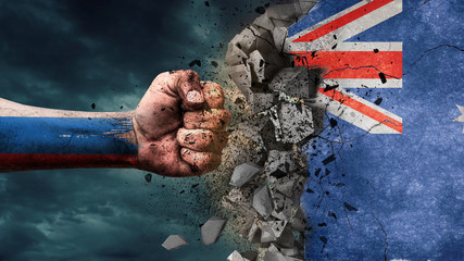 Obraz premium Fist breaking rock. Russia destroying Australia