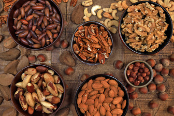 Bowls with nuts, chestnuts, almonds and hazelnuts