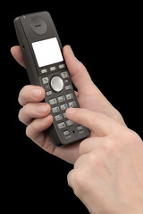 Female hand holds a phone with a white blank screen, isolated on black background