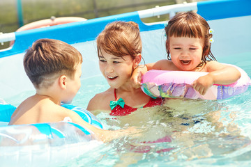 portrait of a happy family outdoors. mom with children in the summer. Mother and kids.