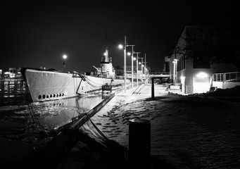 Submarine moored in the winter - 324271557