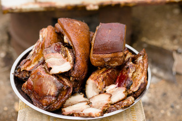 Traditional smoked bacon in a barrel