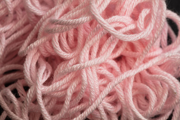 closeup of tangled pink yarn 