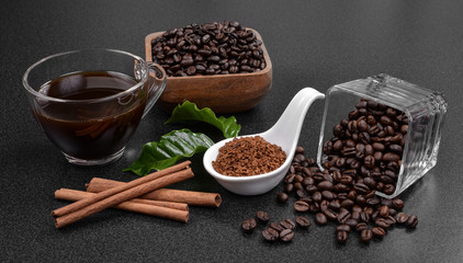 Coffee beans and  cinnamon on  background