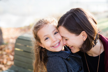 Portrait of a happy mother and daughter smiling