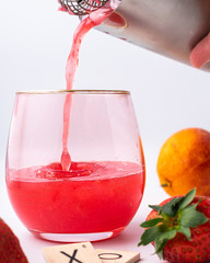 Refreshing citrus mixed drink cocktail, pouring, spalsh