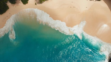 Sea waves Kelingking beach in Nusa Penida island, Bali, Indonesia. Drone view close up.