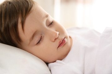 Obraz na płótnie Canvas Cute little baby peacefully sleeping at home. Bedtime