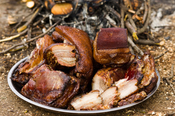 Traditional smoked bacon in a barrel