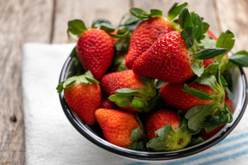 Strawberry fruit on wooden background
